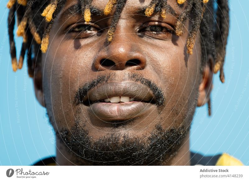 close-up of an attractive young african man mouth person american black male face freedom life emotion guy expression handsome afro horizontal cool ethnicity