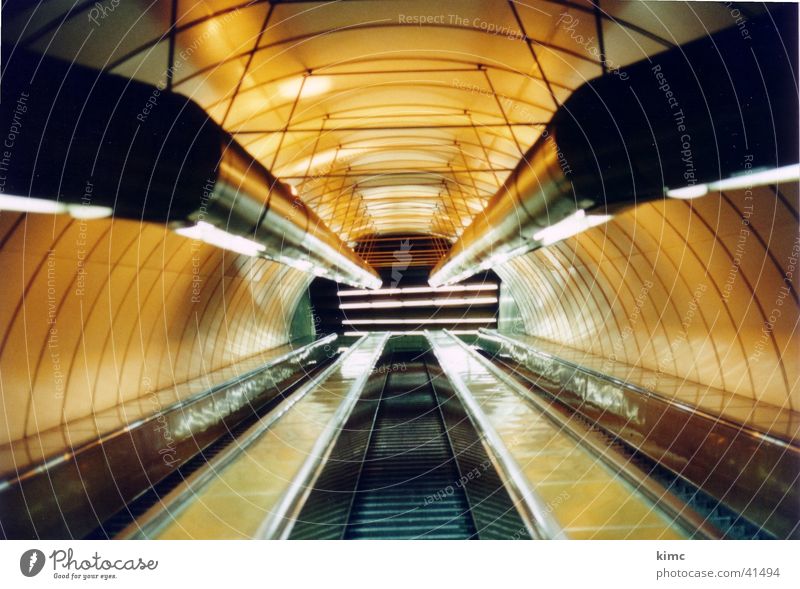 Metro escalator in Prague Escalator Underground Vanishing point Yellow Architecture Light (Natural Phenomenon) Pipe