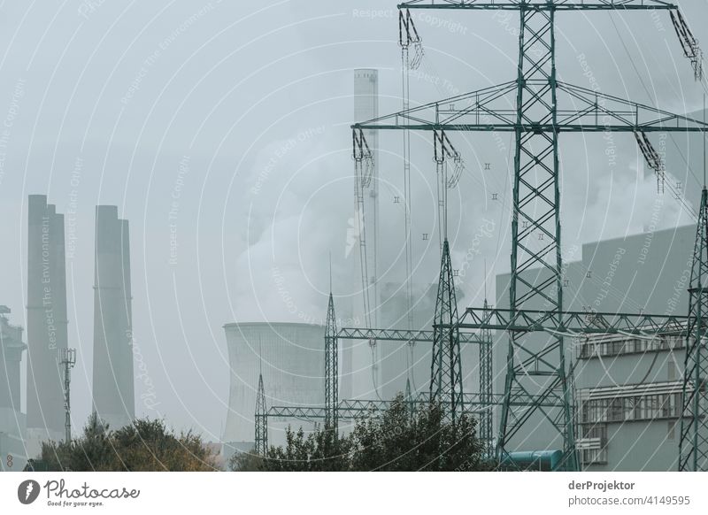 Neurath lignite-fired power plant with electricity pylons Panorama (View) Long shot Deep depth of field Sunbeam Sunlight Shadow Light Day Copy Space middle