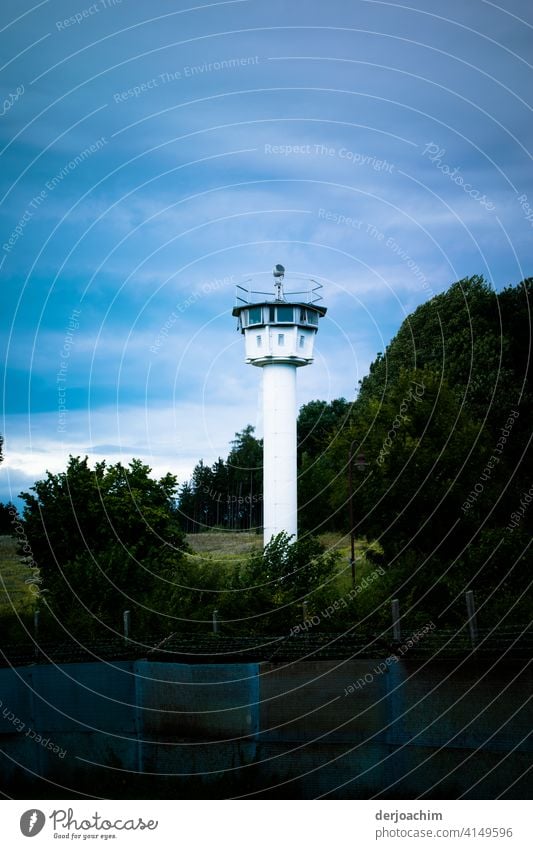 GDR watchtower in the "green". Slim and white. Surrounded by meadows and forest. Watch tower Historic Tower Colour photo Architecture Monument Exterior shot