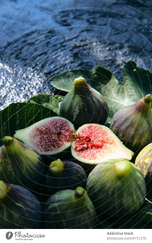 Fresh figs and green leaves in basket fruit fresh natural food leaf organic vitamin veggie ripe delicious ingredient raw nutrition vegetarian vegan harvest