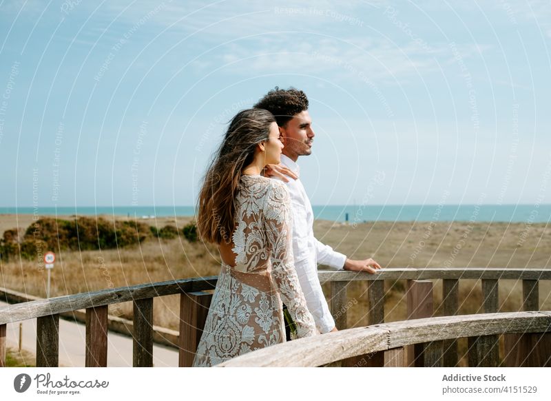 Romantic couple enjoying summer day at seaside romantic admire together relationship newlywed style love young boho bridge bride groom relax happy holiday