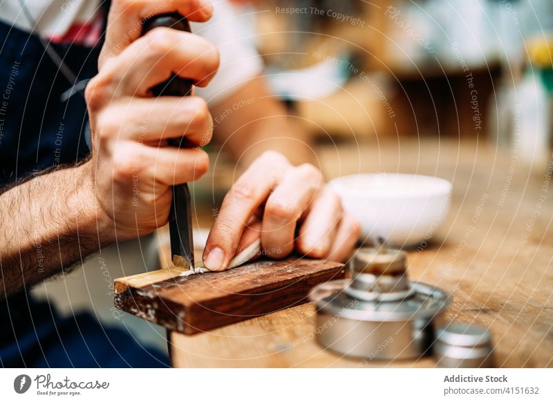 Luthier cutting horsehair for making bow luthier tool craft repair artisan restore hand cutter work sharp workshop equipment skill master male precise maker