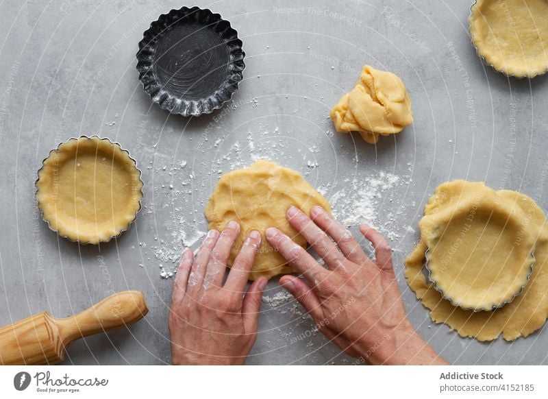 Woman forming dough for pie pastry shortcrust prepare mold food cook kitchen bake hand recipe sweet culinary flour process raw utensil gastronomy confectionery