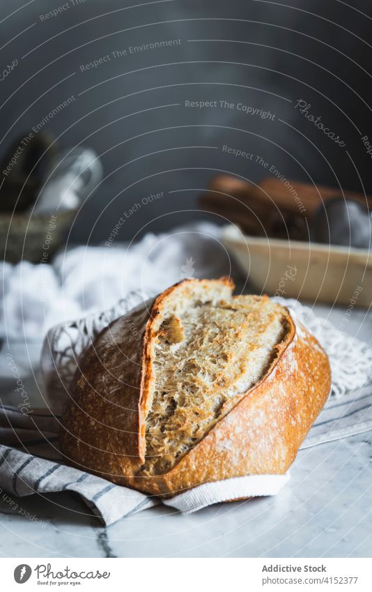 Closeup of a loaf of bread bun crust bakery healthy grain dough delectable lunch fresh homemade meal diet eat brown baked organic food yummy onmytable indoors