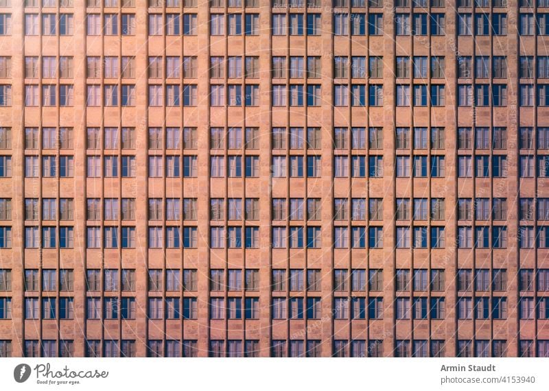 architectural pattern, window facade with reflected light in the evening anonymity anonymous architecture background big block building city construction