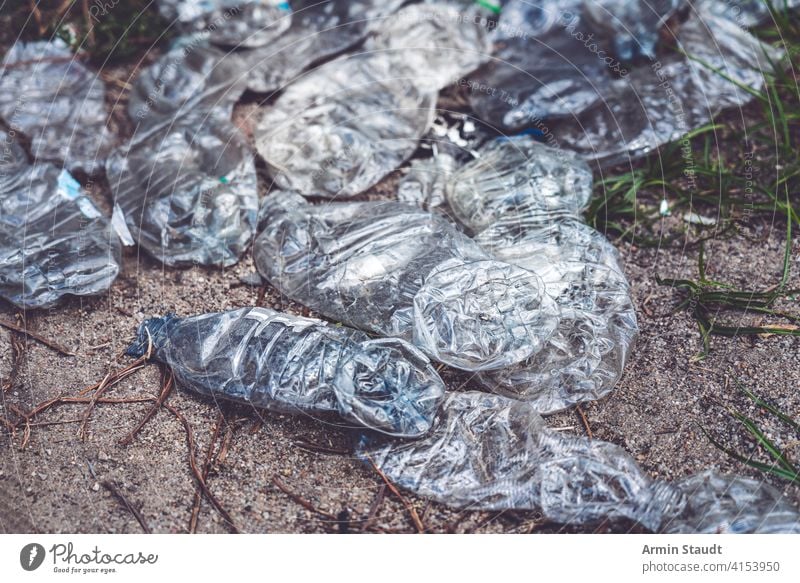 old crushed plastic bottles lying on the floor background beverage closeup dirty discarded earth eco ecological ecology empty environment environmental garbage