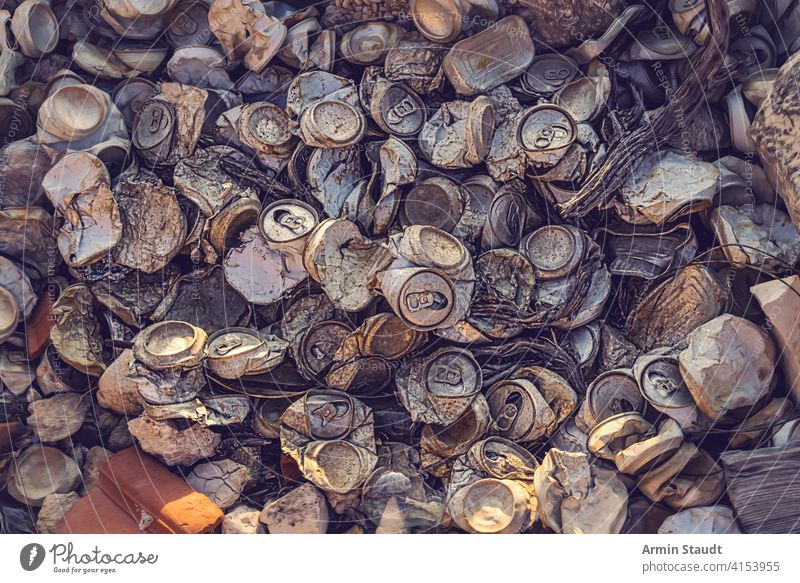 close up of a big heap of old crushed aluminum cans aluminium background beer beverage blank broken closeup compressed crumpled destruction dirt dirty drink