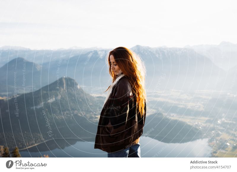 Traveling woman on hill in highlands morning mountain traveler enjoy fog autumn season range female germany austria tourist outerwear stand fall serene trip