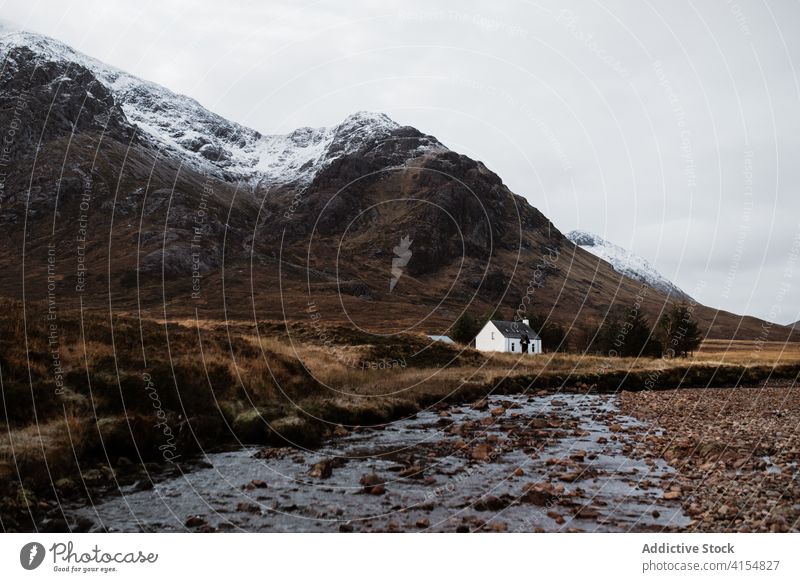 Lonely house in mountainous valley in autumn highland season lonely cold river residential scottish highlands scotland uk united kingdom range cottage calm gray