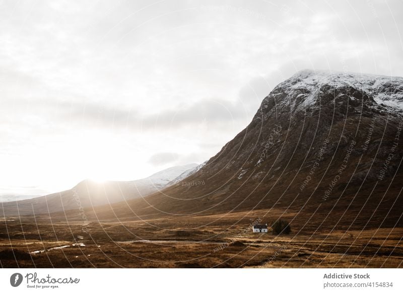 Lonely house in mountainous valley in autumn highland season lonely cold river residential scottish highlands scotland uk united kingdom range cottage calm gray