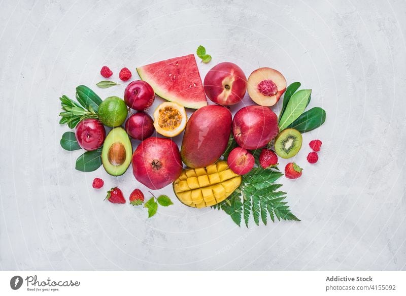 Various tropical fruits on table in studio various exotic arrangement set fresh ripe delicious sweet organic natural composition berry food nutrition mix kiwi