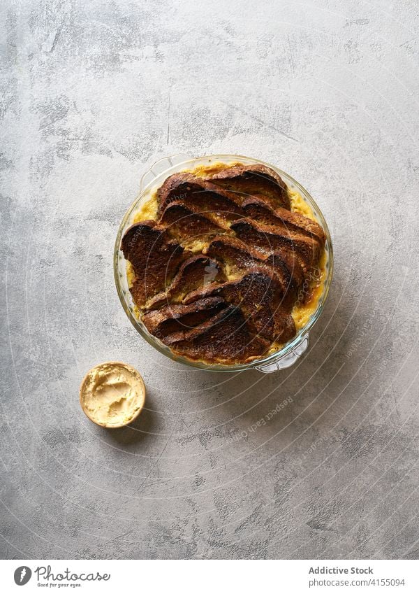 Sweet bread pudding with orange zest butter food custard delicious dessert meal sweet pastry vanilla homemade recipe background cuisine tasty sauce closeup