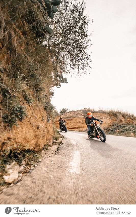 Riders on motorbikes driving on curvy road biker motorcycle ride drive curve speed mountain power fast travel freedom route transport adventure vehicle journey