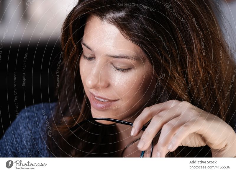 Thoughtful woman taking notes in notebook in cafe take note thoughtful morning cozy glasses smile notepad planner write coffee female cup table pensive drink