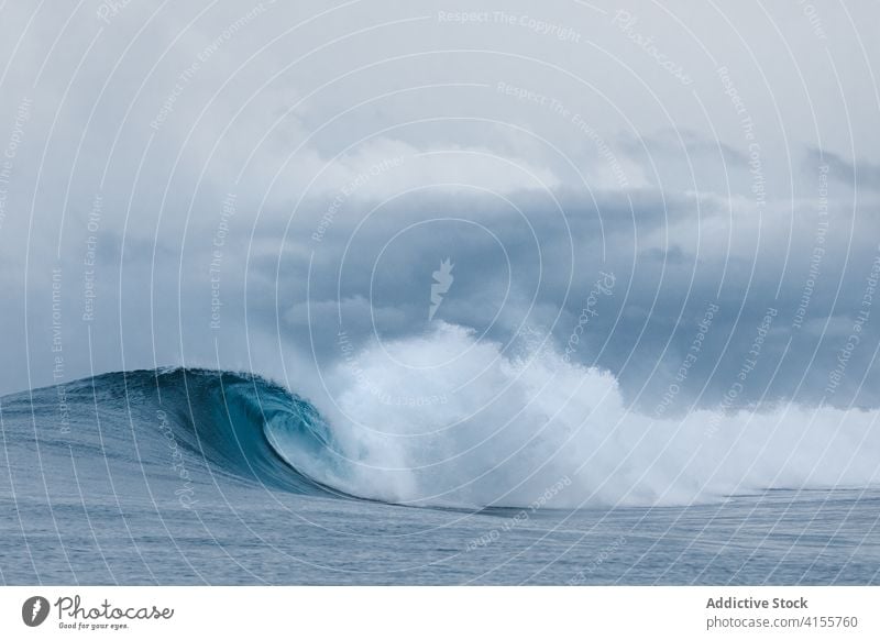 Stormy blue sea with waves ocean power water nature landscape seascape coast surf tropical crest summer splash white foam seashore surface storm wet spray