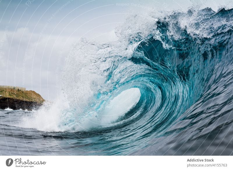 Stormy turquoise sea with waves ocean power water nature landscape blue seascape coast surf tropical crest summer splash white foam seashore surface storm wet