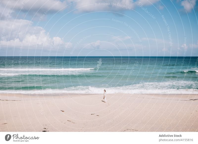 Woman admiring waving sea on beach woman wave sand fresh stormy alone seaside shore female travel tourism spain barefoot enjoy relax recreation breeze summer