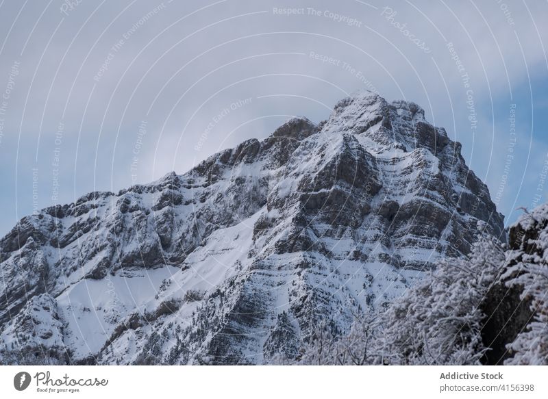 Snowy mountain ridge in winter range snow cloudy sky fog dramatic highland landscape amazing pyrenees huesca spain scenery spectacular cold nature environment