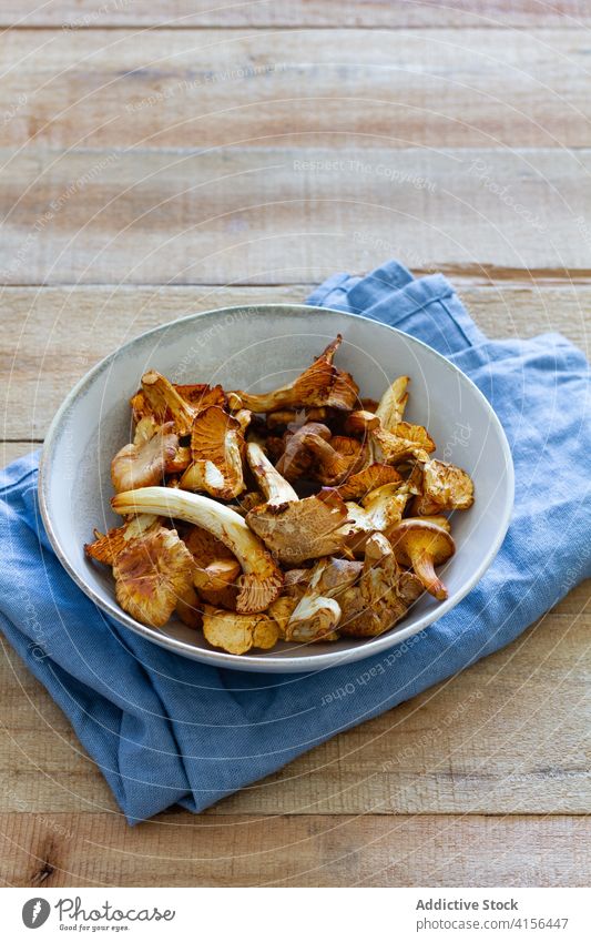 Bowl with mushrooms on wooden table bowl food fresh natural organic ingredient rustic meal nutrition cuisine vegetarian gourmet diet vegan prepare raw edible