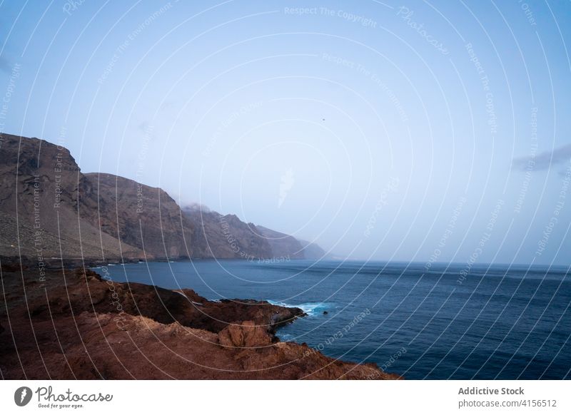 Amazing seascape in foggy morning amazing rocky beach dawn peaceful calm tenerife canary island spain shore breathtaking scenery tranquil coast scenic landscape