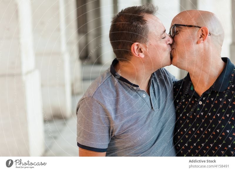 Gay couple in love hugging on street gay men homosexual lgbt relax weekend enjoy city together relationship embrace happy alternative handsome equal gender