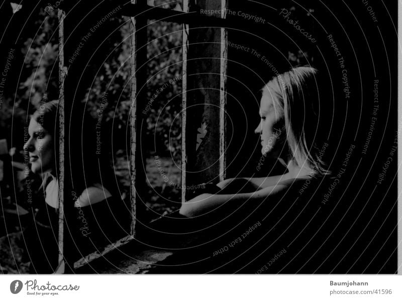 Together alone Grating Window Portrait photograph Silhouette Woman Black & white photo partially exposed Profile