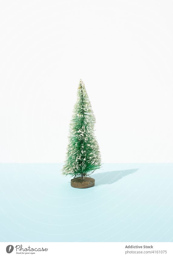 Decorative Christmas tree in studio christmas miniature decoration ornament holiday festive green fir spruce table season december merry celebrate decorative