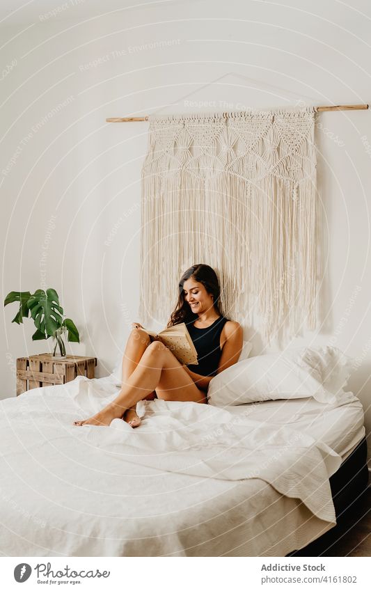 Woman reading book in bedroom woman home morning relax rest comfort chill cozy positive inspiration young female smile literature hobby pleasure leisure weekend