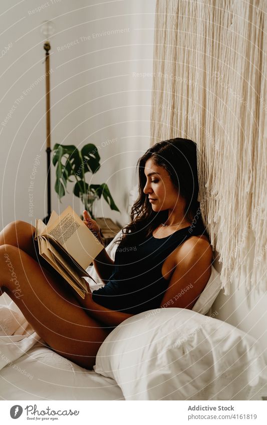 Woman reading book in bedroom woman home morning relax rest comfort chill cozy positive inspiration young female smile literature hobby pleasure leisure weekend