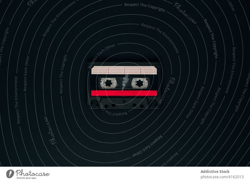 Retro audio cassette on black background tape retro vintage old fashioned compact analog music stereo obsolete plastic listen media storage data mono technology