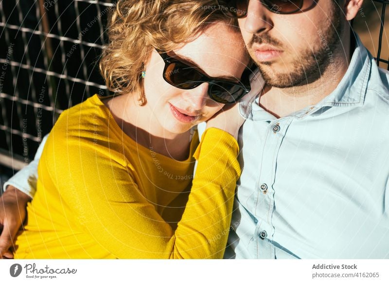 Stylish couple hugging tenderly on terrace love mountain lake romantic embrace in love delicate trendy harmony bonding summer enjoy affection sunny together