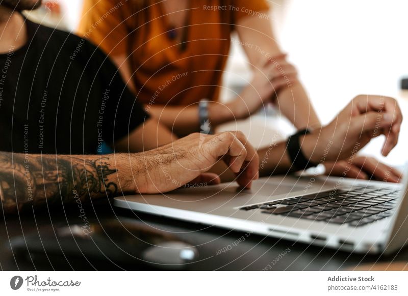 Detail of hand in laptop couple video call happy together holding hands sofa home wave hand cheerful connection conversation relationship boyfriend girlfriend