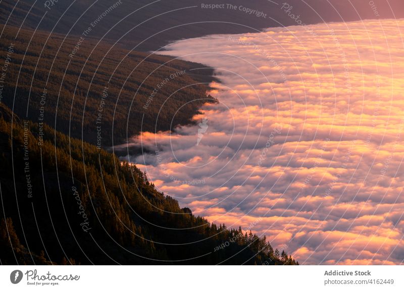 Aerial view of over mountains in morning landscape clouds amazing scenic scenery highland aircraft tenerife canary islands spain detail fly travel plane