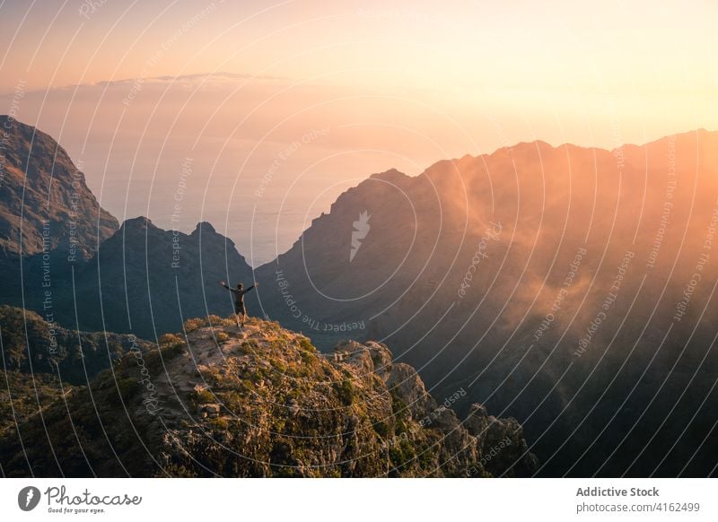 Lonely traveler on mountain range in morning ridge fog explore mountaineer vacation explorer mist tenerife spain canary islands journey landscape scenic