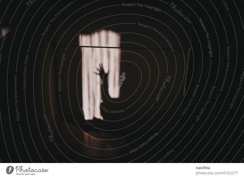 Conceptual image about solitude in quarantine shadow help concept loneliness lonely alone dark darkness mental mental health mental illnes illness depressive