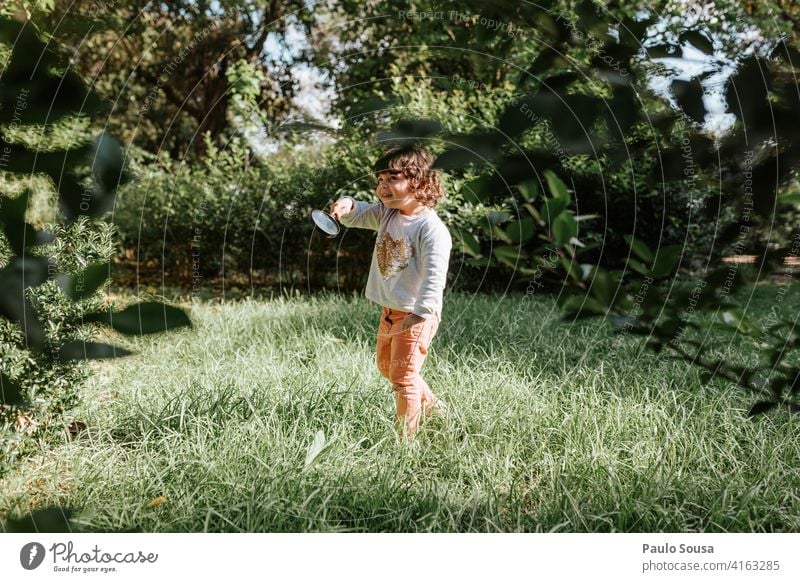 Cute girl playing outdoors Girl 1 - 3 years Caucasian Child childhood Park Spring Colour photo Exterior shot Day Nature Happiness Human being Infancy Lifestyle