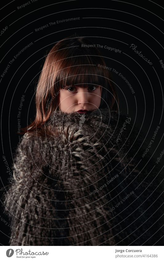 elegant four year old Caucasian girl dressed in feather vest with adorable and endearing expression alone attractive beauty caucasian charming cheerful child