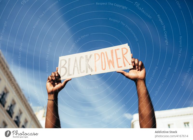 Anonymous black man on demonstration against police brutality protest people racism violence lives social justice black lives matter sign american activism