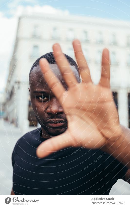 Black man on demonstration against police brutality protest people black racism violence lives social justice black lives matter sign american activism racial