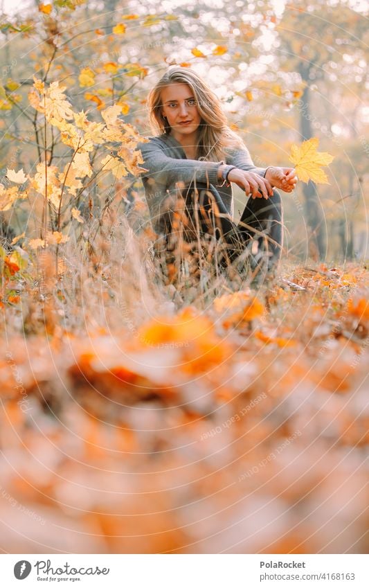 #A9# Autumn sitting Exterior shot Autumnal weather Autumn leaves Hiking Positive To go for a walk Hair and hairstyles being out Experience Nature Young woman