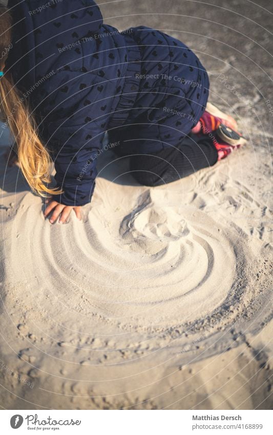 Rainbow in the sand Child Girl Sand Sandy beach Beach Playing coronavirus Summer Vacation & Travel Ocean Summer vacation Relaxation coast Sandpit Tourism