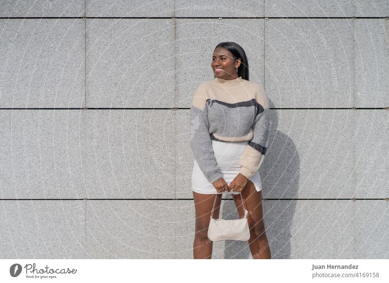 happy young black woman in skirt and sweater spectacular ethnicity african afro smile joy laughing african american lady horizontal standing positive carefree