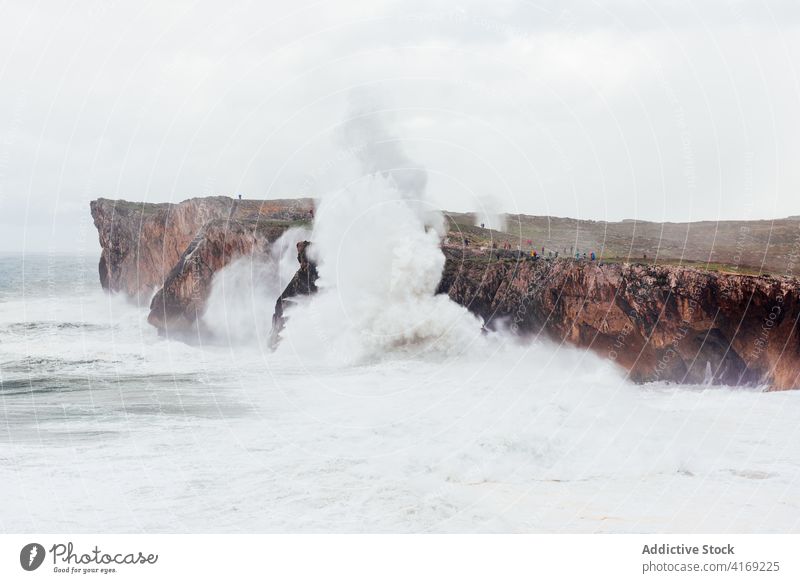 Stormy sea near rocky cliff stormy foam wave seascape power water roll scenery spectacular rough picturesque landscape majestic splash sunny stone nature scenic