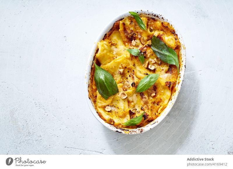 Appetizing baked squash served on table dish vegan vegetarian food vegetable garnish basil delicious green dinner tasty cook tradition ingredient recipe