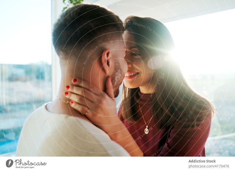 Couple cuddling in kitchen at home couple hug counter cuddle tender relationship embrace serene affection romantic together love casual fondness bonding rest