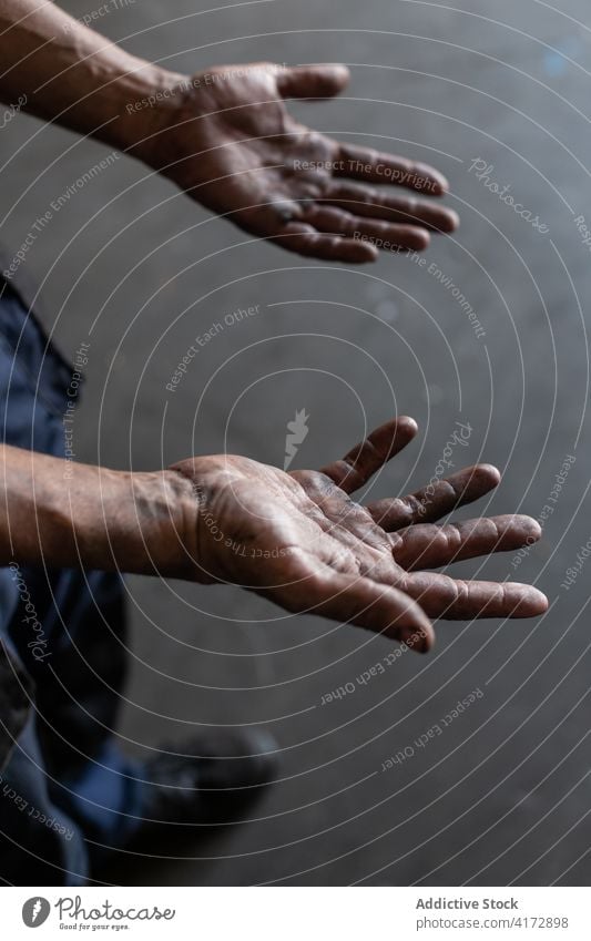 Anonymous mechanic demonstrating dirty hands in workshop worker demonstrate repairman job professional service occupation skill manual labor craftsman employee