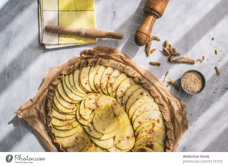 Apple Galette served on table apple galette cooked edible apple pie crust sugar cinnamon french baked tasty fresh healthy apples organic bakery spice meal slice