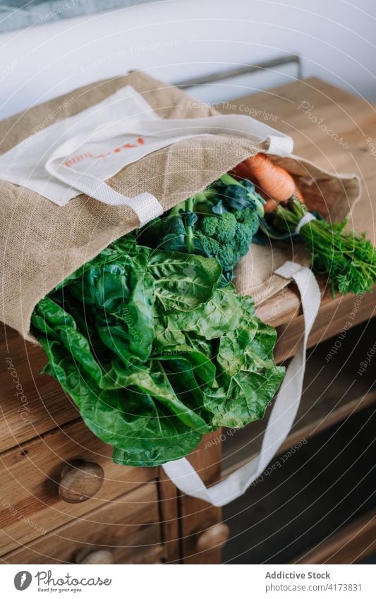 Assorted fresh vegetables on wooden shelf natural organic food market agriculture various grocery assorted bunch broccoli carrot greenery healthy vegetarian bag