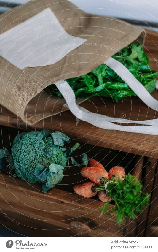 Assorted fresh vegetables on wooden shelf natural organic food market agriculture various grocery assorted bunch broccoli carrot greenery healthy vegetarian bag